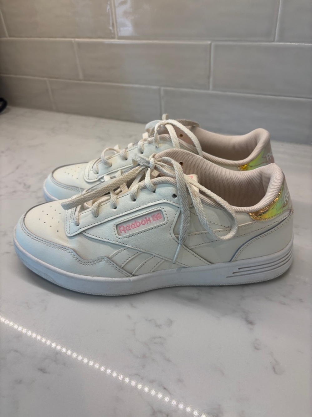 Reebok White Low-Top Sneakers with Pink Logo and Iridescent Heel Accent